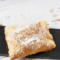 Bougatsa · Filo dough pastry filled with honey-lemon custard and sprinkled with cinnamon and powdered s...