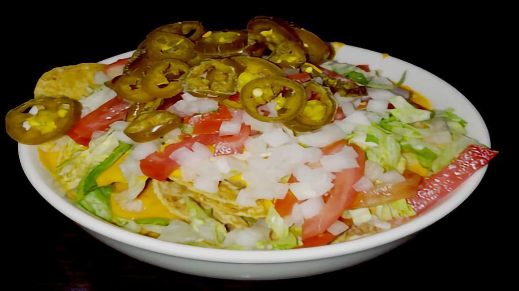 Tossed Salad  · Lettuce, tomatoes, cucumber, onion