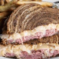 Rustler'S Reuben · Sliced corned beef, sauerkraut, Swiss & Thousand Island on grilled marble rye. Served with a...