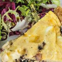 Quiche Forestiere Slice · Savory tart with mushroom, caramelized onions and Swiss cheese.