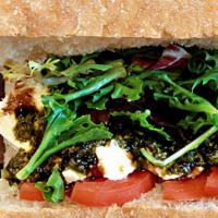 Caprese · Vegetarian sandwich with an Italian style. 
Mixed greens, tomato, mozzarella, pesto and bals...