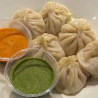 Veggie Momo · Vegetarian. Cabbage, onion, spring onion, carrot, spinach, ginger, garlic, spices.
