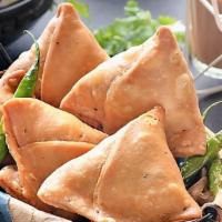 Vegetable Samosa (Two Piece) · Crispy fried pastry stuffed with spicy potatoes and peas served with tangy tamarind and spic...
