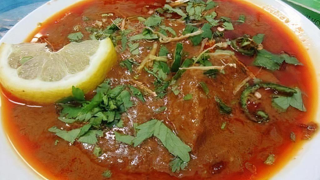 Beef Nihari · A rich and decadent, slow-cooked beef shank curry made with eastern spices, ginger, garlic. Garnished with ginger juliennes, brown onions, fresh chopped cilantro and lemon wedges served with yogurt cilantro chutney.