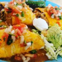 Burrito De Carne Asada / Roast Beef Burrito · Churrasco, frijoles refritos y arroz mexicano con salsa especial, queso cheddar, pimientos v...