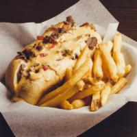 Beer Cheesesteak · Shaved ribeye steak sautéed with onions & red bell peppers, stuffed in a Milano roll then co...