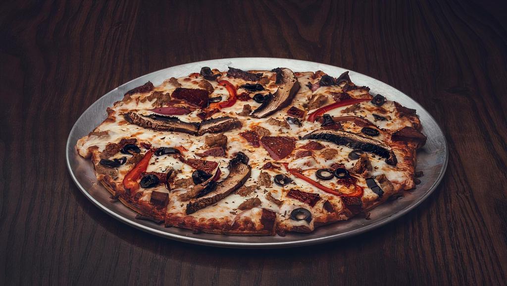 Tavern Deluxe Pizza · Marinara, rough cut pepperoni, Italian sausage, red bell peppers, red onions, portabella mushrooms & mozzarella
