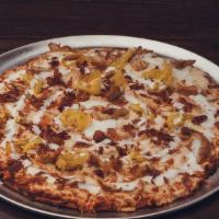 Booyah Buffalo Pizza · Creamy Buffalo sauce, pulled chicken, smoked bacon, banana peppers, mozzarella, ranch swirl.