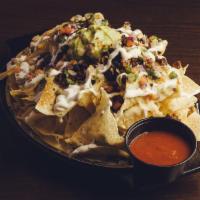 T24 Nachos · Tortilla chips piled w/ your choice of meat, black beans, queso blanco, white cheddar, sour ...