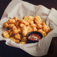 Cheese Curds · Wisconsin squeaky white cheddar cheese curds hand breaded & fried into gooey bites w/ choice...