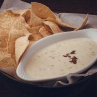Queso Blanco · White cheese melted with Pico de Gallo w/ tortilla chips & salsa. Substitute waffle fries fo...