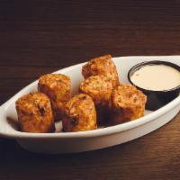 Tater Kegs · Giant tater tots filled w/ cheddar, bacon & chives w/ choice of beer cheese, sour cream or r...