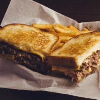 Frisco Patty Melt · 1/2 pound smash burger w/ sautéed red onions, American cheese, Swiss cheese & thousand islan...