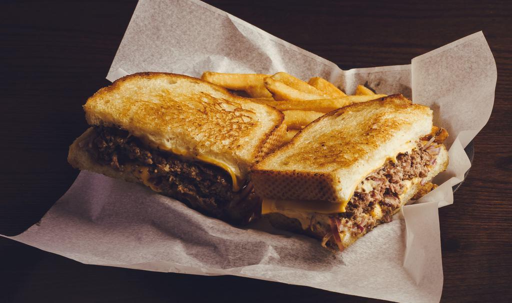 Frisco Patty Melt · 1/2 pound smash burger w/ sautéed red onions, American cheese, Swiss cheese & thousand island dressing on San Francisco sourdough toast.