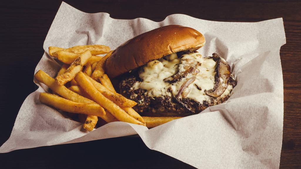 The Fun Guy · 1/2 pound blackened burger with sautéed portabella mushrooms & onions, melted Swiss & bleu cheese crumbles on a brioche bun.
