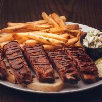 Honey Whiskey Ribs · 1/2 rack of hickory smoked pork spareribs drizzled in honey whiskey BBQ sauce w/ fries, cole...