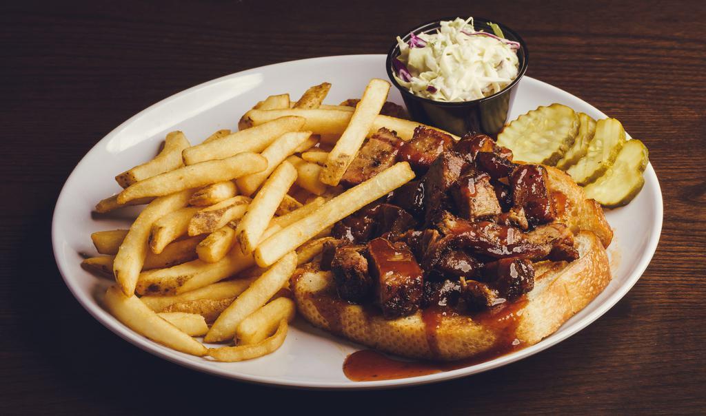 Burnt Ends · 1/2 pound smoked burnt end brisket drizzled in honey whiskey BBQ sauce with fries, coleslaw, pickles & toast.