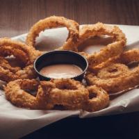 Onion Rings Side · Crispy onions rings with Tavern Sauce.