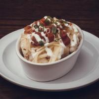 Loaded Mashed Potato Side · Mashed potatoes topped with white cheddar cheese, bacon, sour cream & chives.