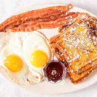 Continental Breakfast · Four wedges of French toast with two eggs and choice of two bacon strips or two sausage links.