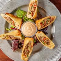 Philly Egg Rolls · Philly meat, red and green peppers, caramelized onions, shredded pepper jack cheese then rol...