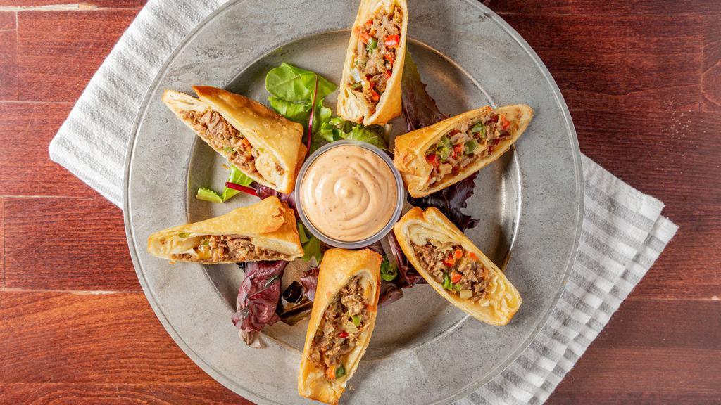 Philly Egg Rolls · Philly meat, red and green peppers, caramelized onions, shredded pepper jack cheese then rolled in a flour tortilla and lightly deep. Served with chipotle aioli.