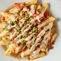 Loaded Fries · Heaping pile of fries, queso ,chopped, bacon, pico and jalapeno ranch.