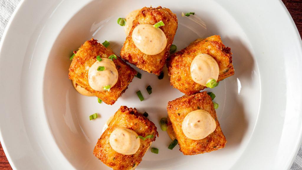 Tater Kegs · Stuffed tater tots, loaded with cheese and bacon served with chipotle aioli.