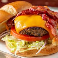 The Classic · Most Popular.
Half pound burger topped with cheddar cheese, thick cut bacon, lettuce, tomato...