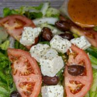 Greek Salad · Iceberg lettuce, romaine lettuce and mescaline mix base with tomatoes, onions and green pepp...