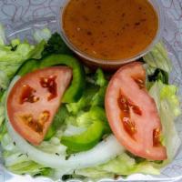 Side Garden Salad · Iceberg lettuce, romaine lettuce and mescaline mix base with tomatoes, onions and green pepp...