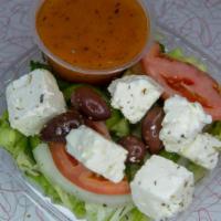 Side Greek Salad · Iceberg lettuce, romaine lettuce and mescaline mix base with tomatoes, onions and green pepp...