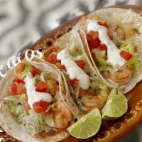 Flour Tacos Supreme · Choice of meat which comes with lettuce, tomatoes, sour cream and cheese.