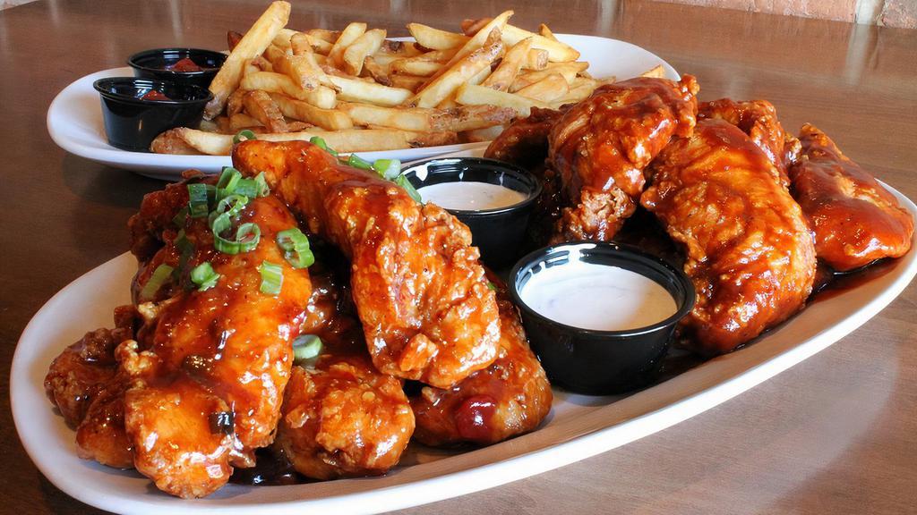 Boneless Wings & Fries · Two orders of our Boneless Wings along with a generous helping of Fries. Two sauce choices for your wings, but you can make them both the same if you like!