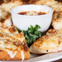 Garlic Cheese Bread · Our homemade bread toasted with garlic butter, mozzarella and Parmesan cheese, and Italian s...