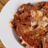 Cheesy Meatball Dip · Large meatballs chopped and sautéed in marinara. Topped with melted mozzarella, herbs, parme...