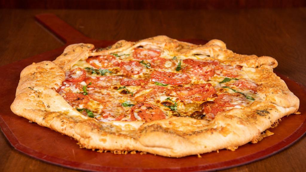 Margherita Pizza · Olive oil, fresh basil, garlic, roma tomatoes, mozzarella, and MontAmoré® cheese. Not available as deep dish.