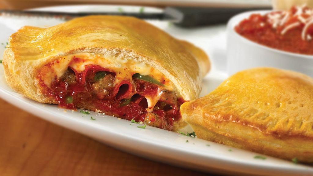 Extreme Supreme Calzone · Sausage, pepperoni, Canadian bacon, mushrooms, onions, green peppers, black and green olives with extra cheese.