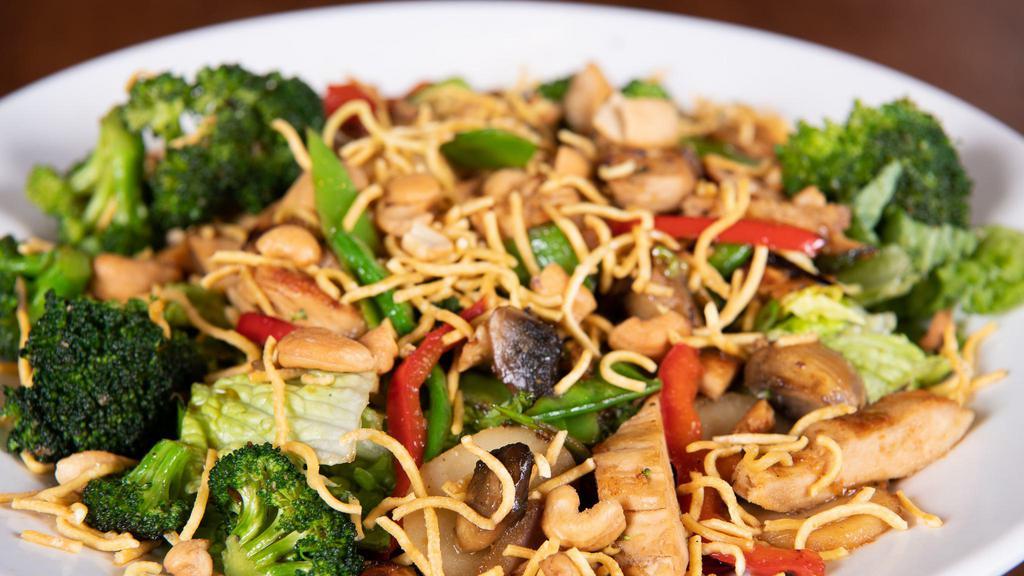 Eating Fit! Chicken Stir Fry Salad · Romaine, marinated chicken, broccoli, water chestnuts, pea pods, red peppers, red onions, mushrooms, and roasted cashews, in teriyaki dressing. Topped with fried noodles.
