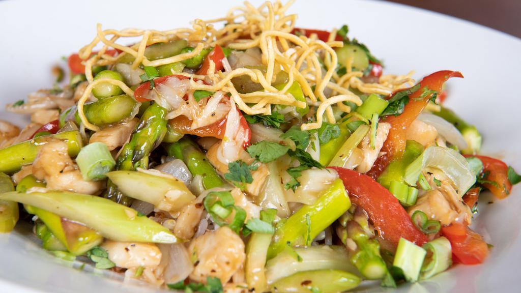 Eating Fit! Chicken Asparagus Stir Fry Bowl · Chicken, asparagus, cabbage, red bell peppers, celery, and onions tossed in a sesame stir fry sauce atop a bed of brown rice quinoa. Topped with jalapeños, cilantro, green onions, and fried noodles.
