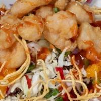 Peking Shrimp Bowl · Tempura battered shrimp served over a bed of brown rice quinoa, cabbage, roasted jalapeños, ...