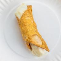 Cannoli · An Italian pistachio pastry shell filled with chocolate chips and a sweet creamy filling.