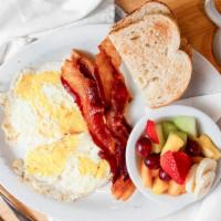 Big Bite Breakfast · Two eggs with your choice of bacon, sausage or ham, and your choice of side and toast.