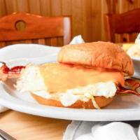 Big Breakfast Sandwich · Two over-hard eggs, bacon, cheddar and chipotle mayo on a toasted brioche roll. Served with ...
