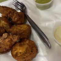 Onion Pakora · Onion in spiced chickpea batter clumps deep fried in vegetable oil