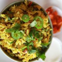 Lemon Rice · Lemon flavored rice with fresh coriander, ginger, green chilies and green peas.
*All rice di...