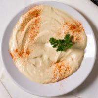 Hummus · Vegetarian. Chickpeas blended with tahini sauce, garlic and lemon.