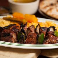Shish Kabob · Beef tenderloin, char-broiled with tomatoes, green peppers and onions. Comes with 2 sides.
