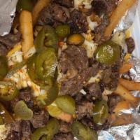 Byo Fries · Beef or Chicken (Bacon, Steak or Shrimp for an additional charge), fries, nacho cheese & 4 t...