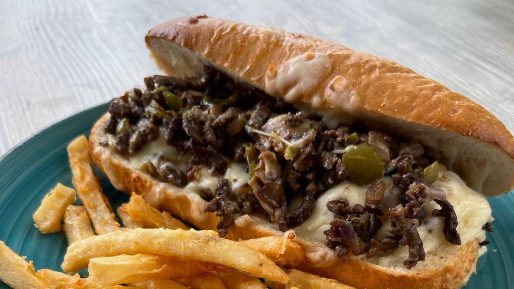 Beef Philly Cheesesteak · Thinly sliced steak cooked with mushrooms, onions, and green peppers and seasoned with our special blend and topped of with mozzarella cheese on a 7 inch sub roll.